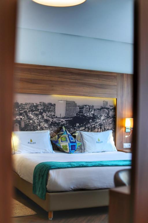 Postel nebo postele na pokoji v ubytování Melliber Appart Hotel
