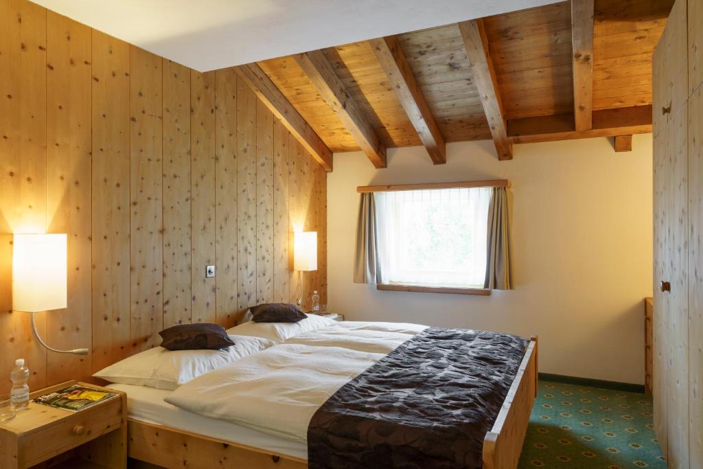 Postel nebo postele na pokoji v ubytování Hotel Saluver