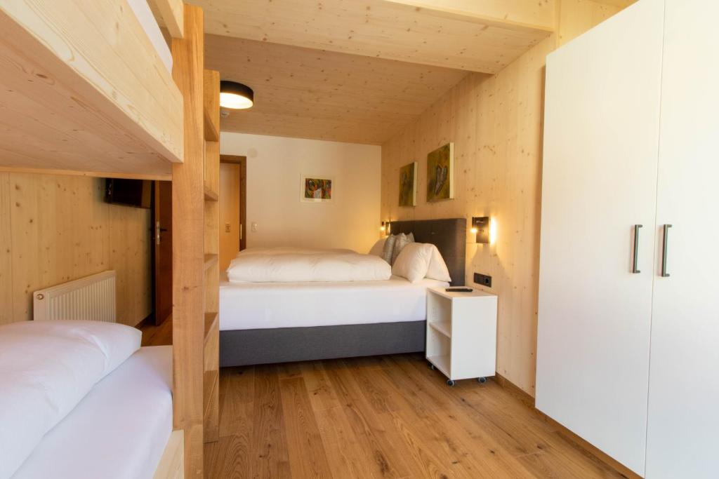 Ein Bett oder Betten in einem Zimmer der Unterkunft Wally Berg-Appartements