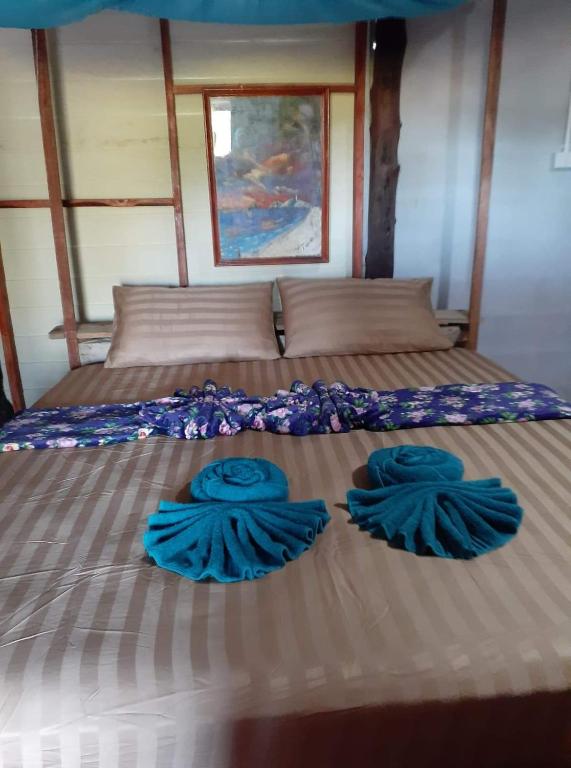 Postel nebo postele na pokoji v ubytování Blue Sky Bungalow