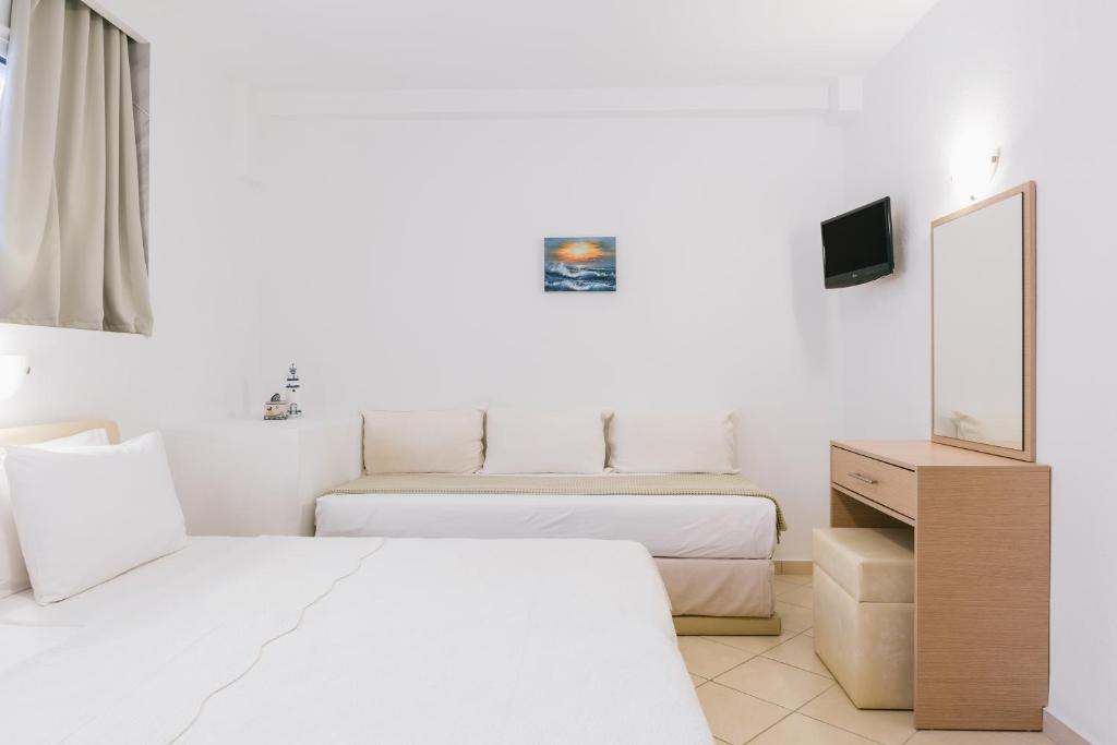 Postel nebo postele na pokoji v ubytování Anastasia Apartments Hanioti