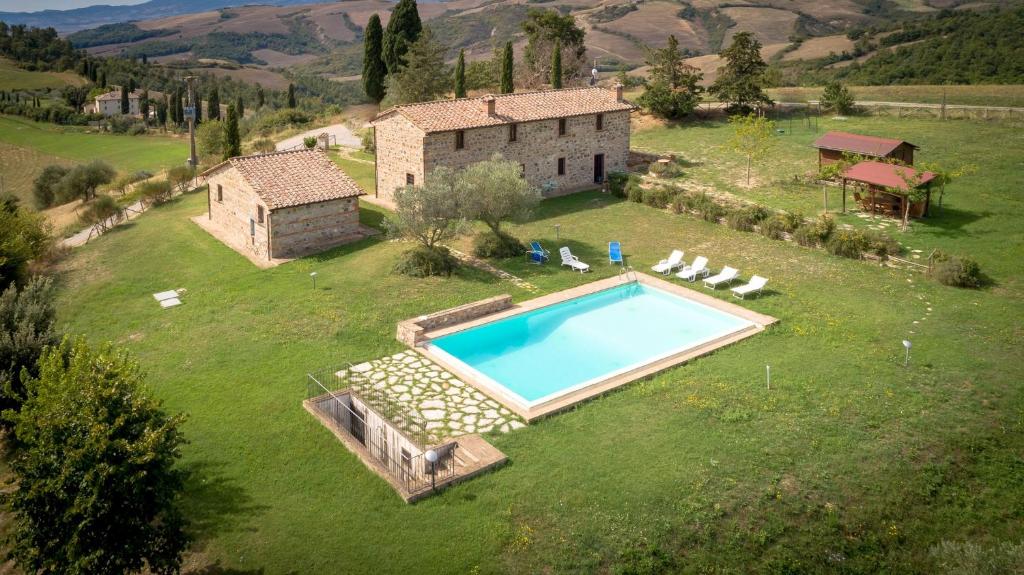 an aerial view of a house with a swimming pool at Villa Podere Oliveto in Radicofani