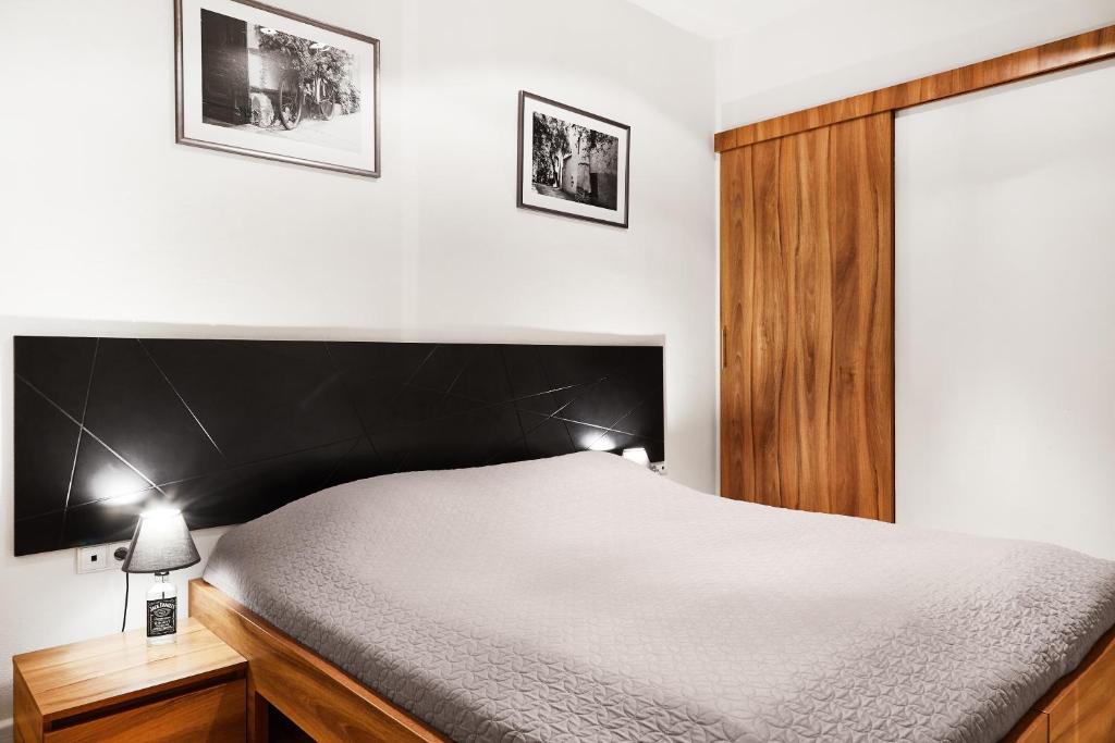 Posteľ alebo postele v izbe v ubytovaní Krakow For You Main Square Apartments