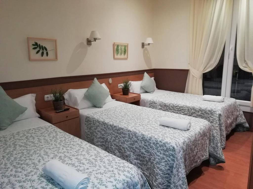Cama o camas de una habitación en Pensión San Jerónimo