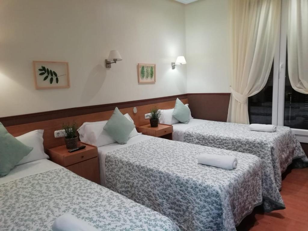 Cama o camas de una habitación en Pensión San Jerónimo
