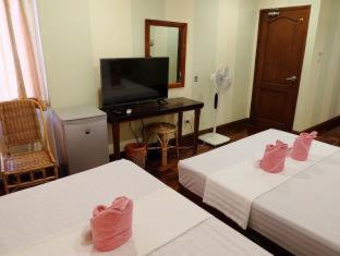 TV a/nebo společenská místnost v ubytování El Nido Beach Hotel