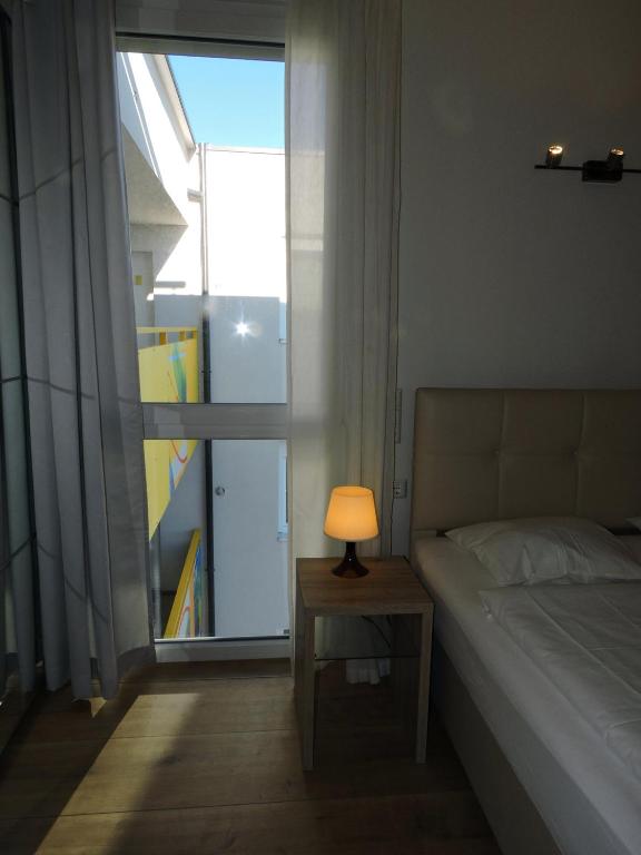 A bed or beds in a room at 211 Amsterdam, Studio Apartment, 30m2 1-4 Pers