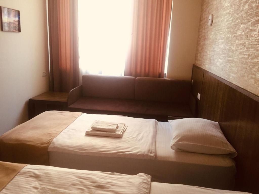 Postel nebo postele na pokoji v ubytování Hobby Hotel