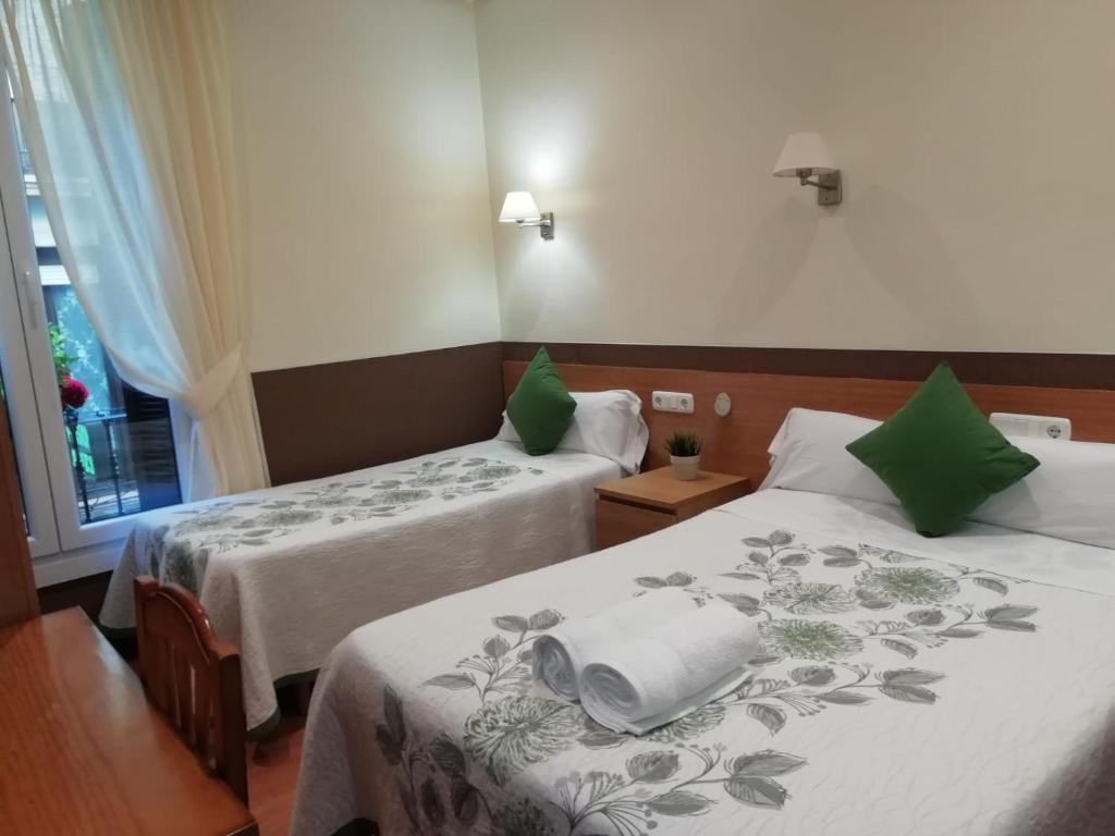 Cama o camas de una habitación en Pensión San Jerónimo