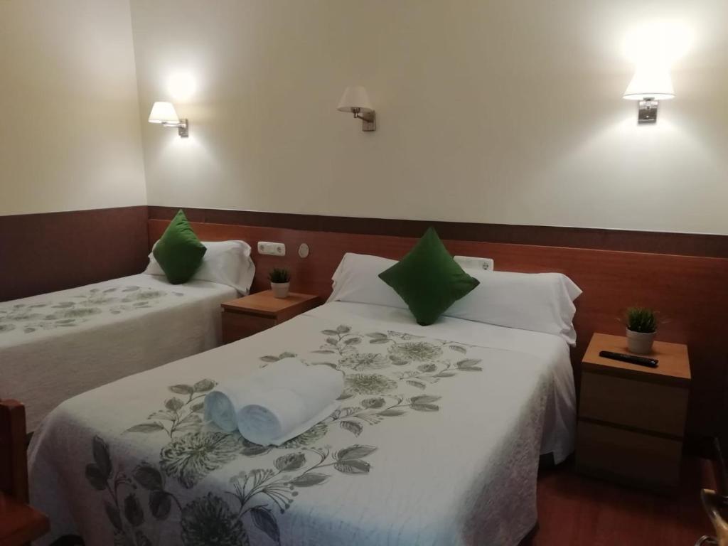Cama o camas de una habitación en Pensión San Jerónimo