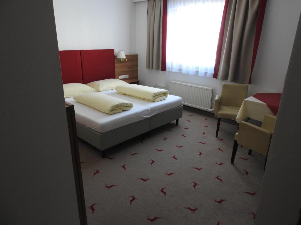 Postel nebo postele na pokoji v ubytování Hotel Moawirt