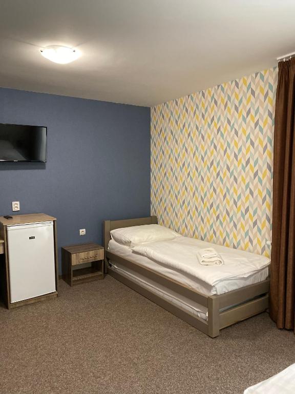 Postel nebo postele na pokoji v ubytování Penzion Panorama