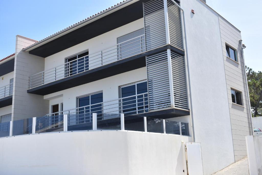 a white building with balconies on it at Casa da Vitoria in Falca