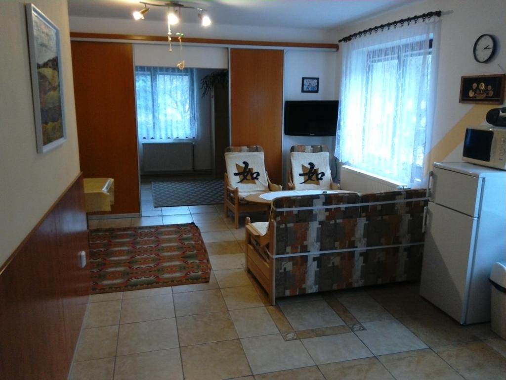 Łóżko lub łóżka w pokoju w obiekcie Apartmány pod Suchým Vrchem