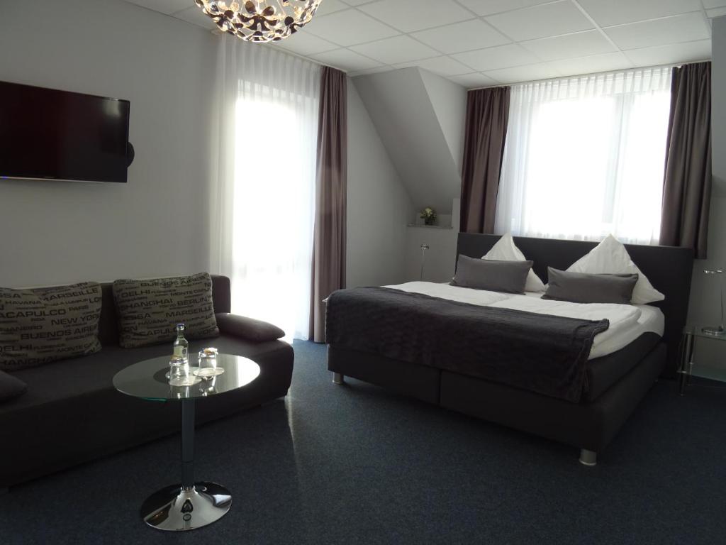 Postel nebo postele na pokoji v ubytování Komm' In Hotel