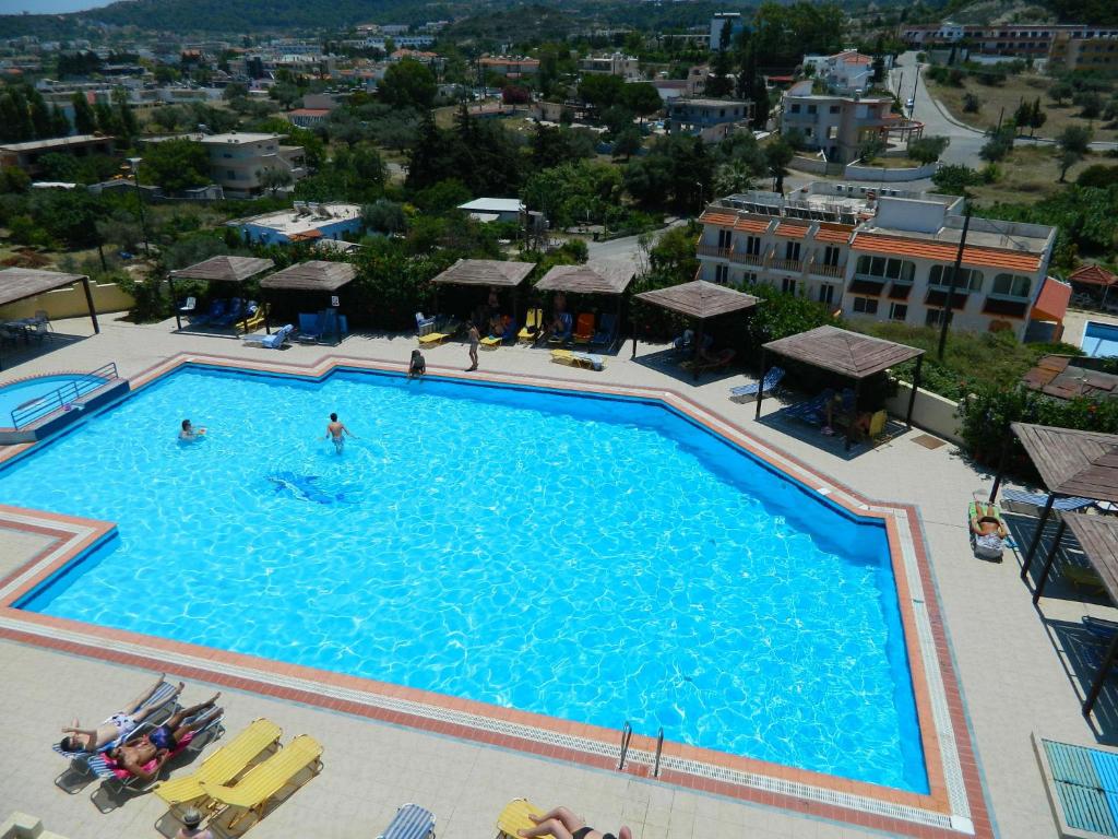 an overhead view of a large swimming pool at Telhinis Hotel & Apartments in Faliraki