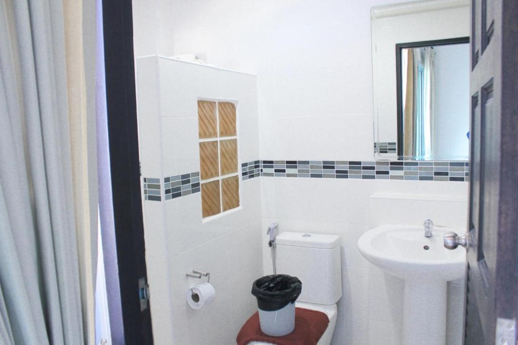 Koupelna v ubytování Plus Hotel