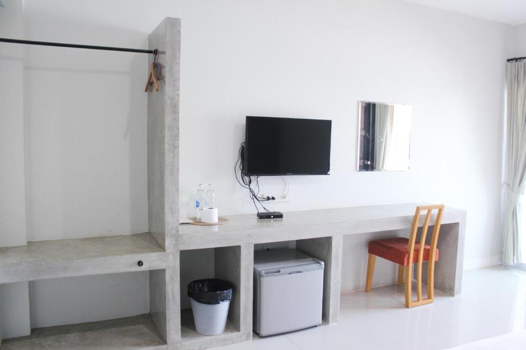 TV a/nebo společenská místnost v ubytování Plus Hotel