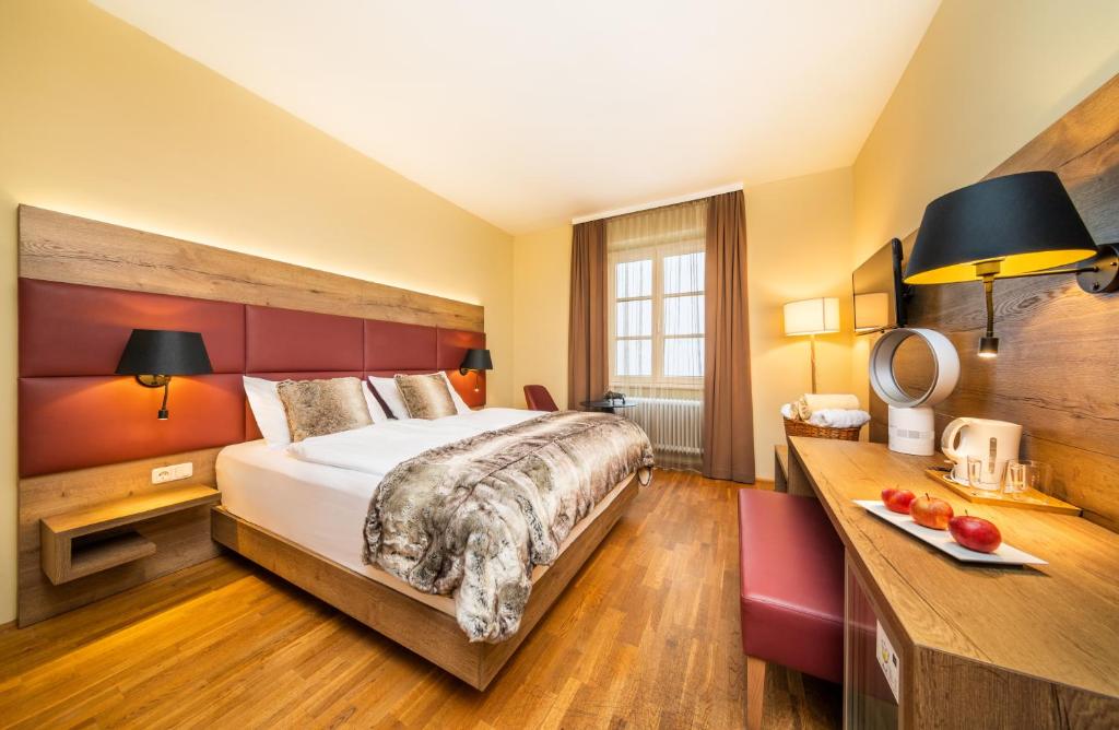Postel nebo postele na pokoji v ubytování Das Gutenbrunn Thermen & Sporthotel