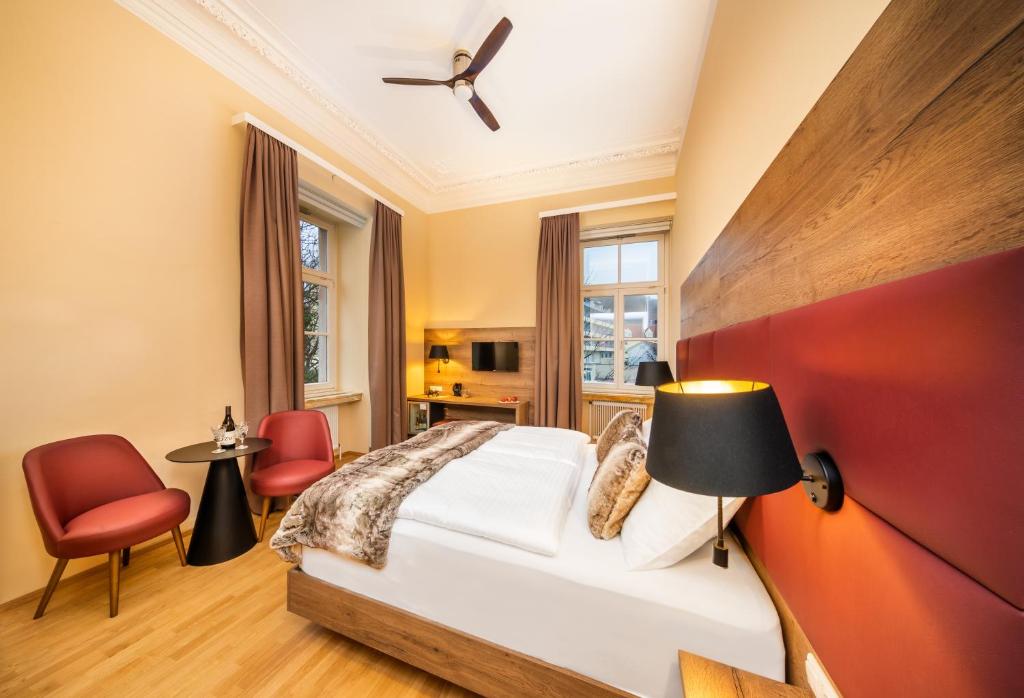 Postel nebo postele na pokoji v ubytování Das Gutenbrunn Thermen & Sporthotel
