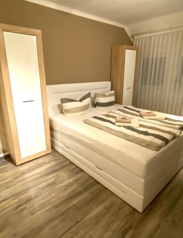 Postel nebo postele na pokoji v ubytování Wilsmann Apartmentvermietung
