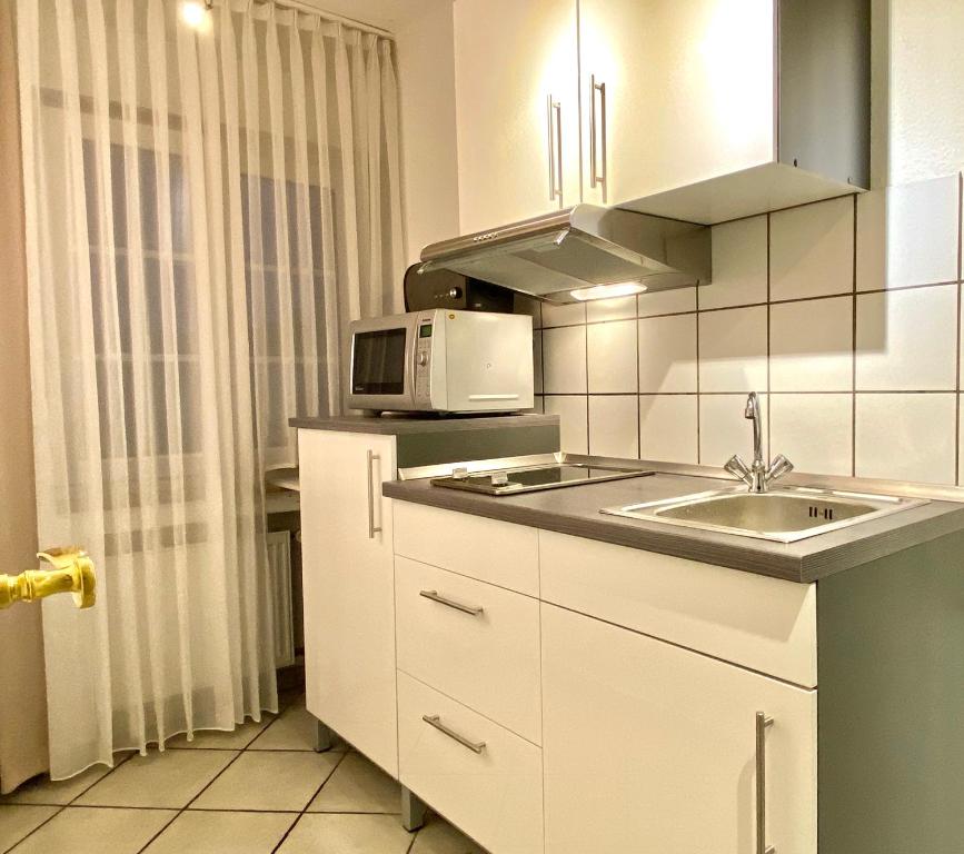 Kuchyň nebo kuchyňský kout v ubytování Wilsmann Apartmentvermietung