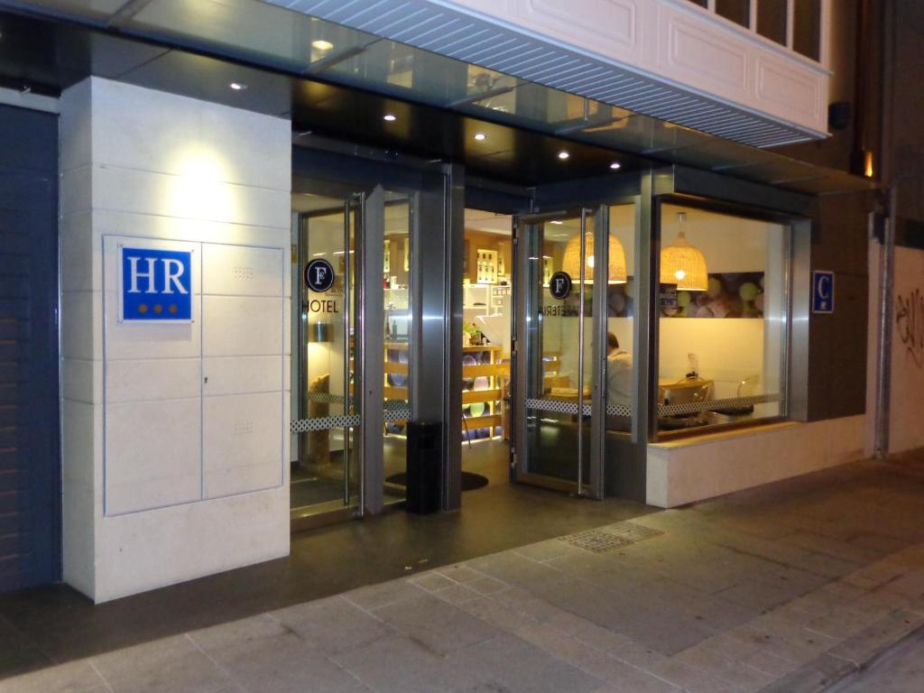 an entrance to a store with revolving doors at Hotel Forum Evolución in Burgos