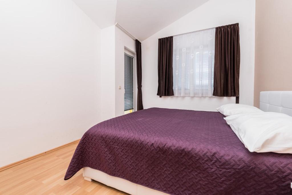 Posteľ alebo postele v izbe v ubytovaní Apartments Danijela 1