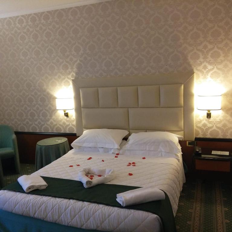 Postel nebo postele na pokoji v ubytování Hotel Principe