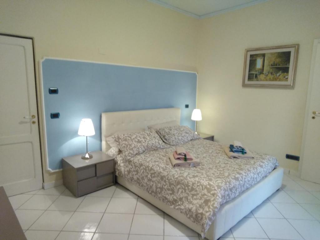 Postel nebo postele na pokoji v ubytování B&B Villa Rosa Angrisano