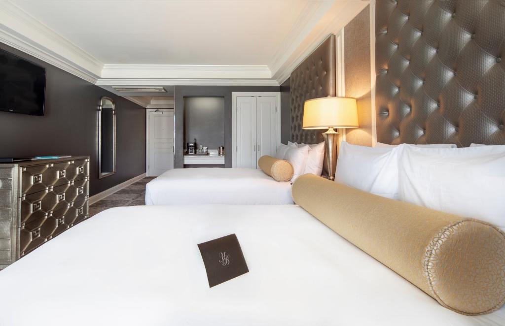 Postel nebo postele na pokoji v ubytování Hotel Ballard
