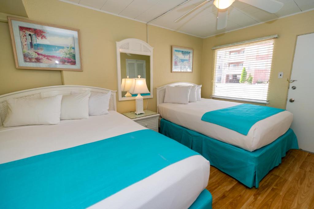 Postel nebo postele na pokoji v ubytování Aztec Motel Wildwood Crest Beach