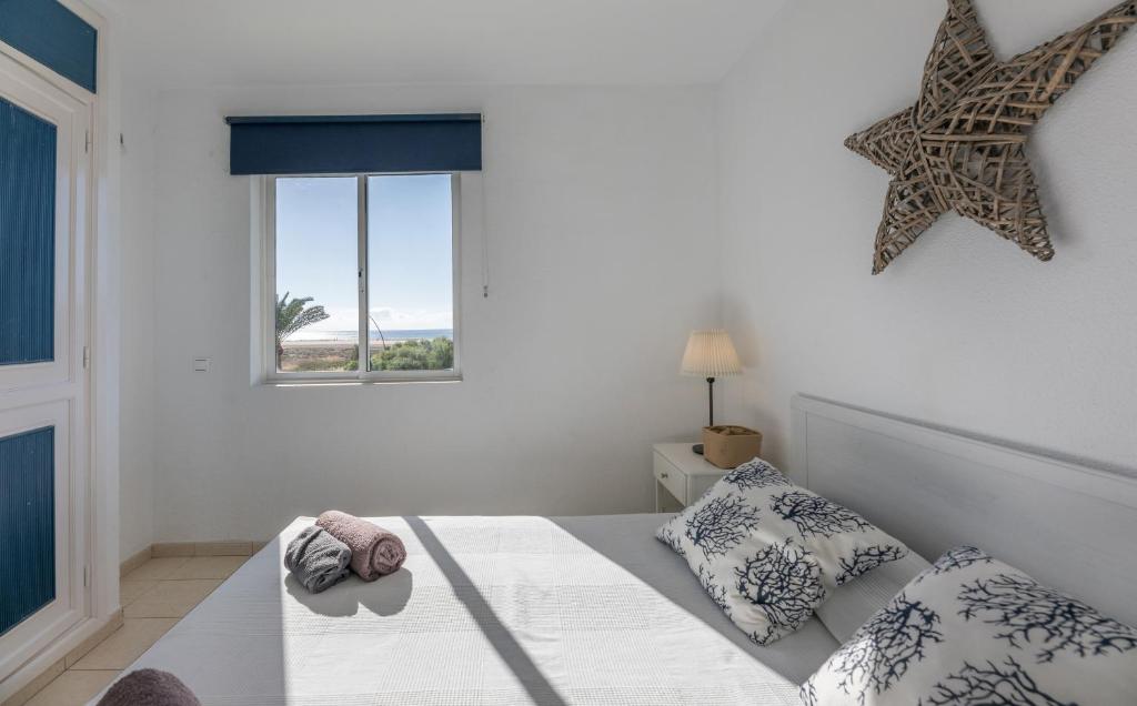 En eller flere senge i et værelse på Casa Sol de Jandía