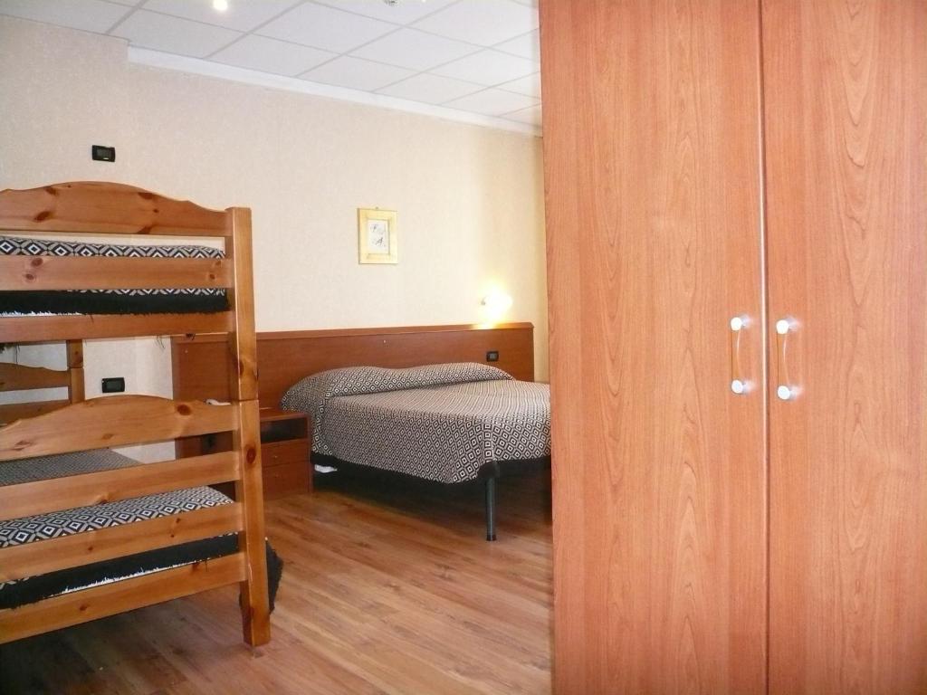 Postel nebo postele na pokoji v ubytování Albergo Belvedere