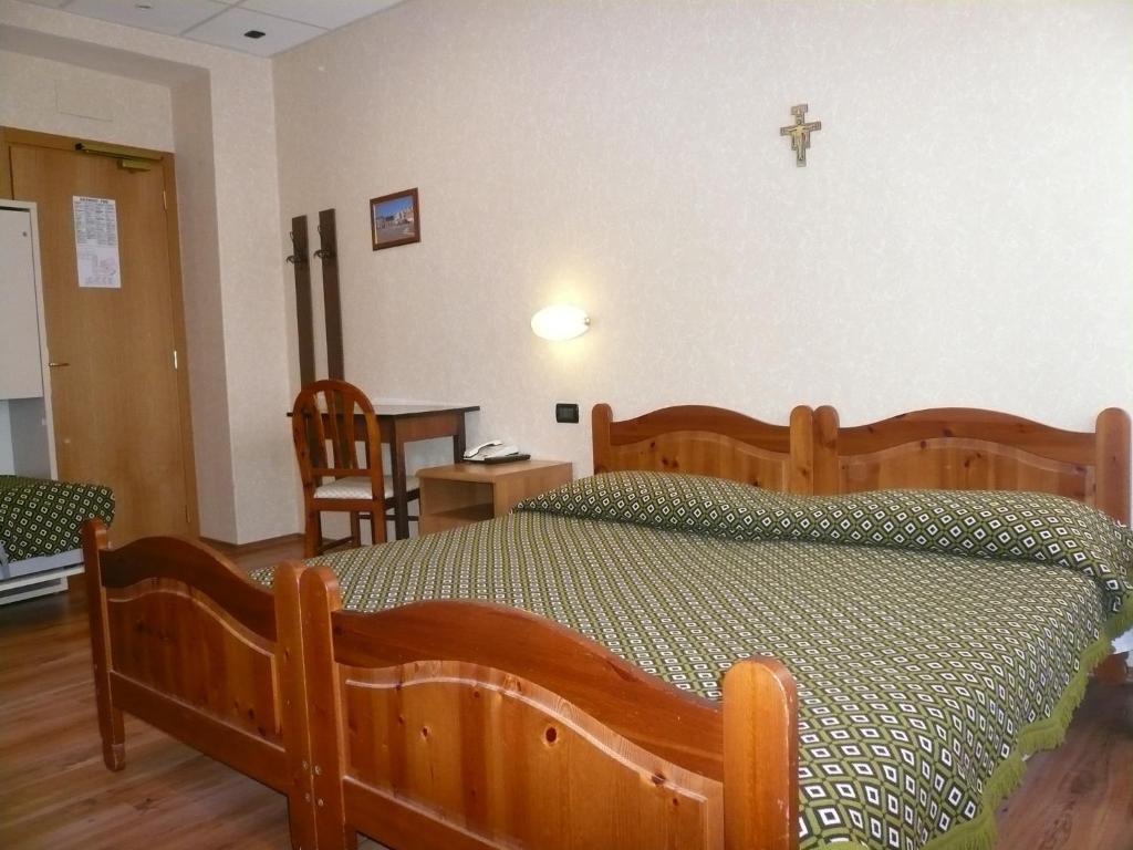 Postel nebo postele na pokoji v ubytování Albergo Belvedere