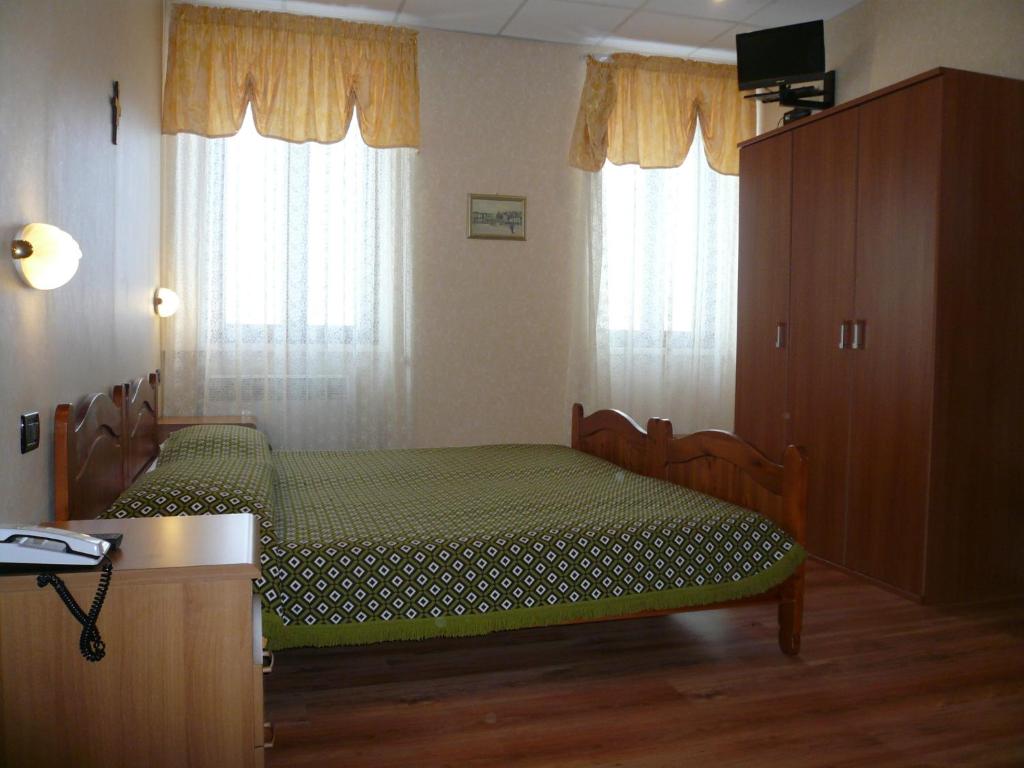 Postel nebo postele na pokoji v ubytování Albergo Belvedere