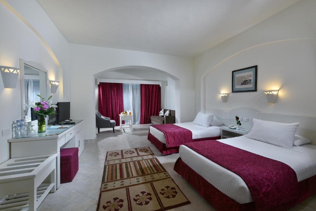 Postel nebo postele na pokoji v ubytování Swisstouch Resort ex Sentido Dream Marsa Alam
