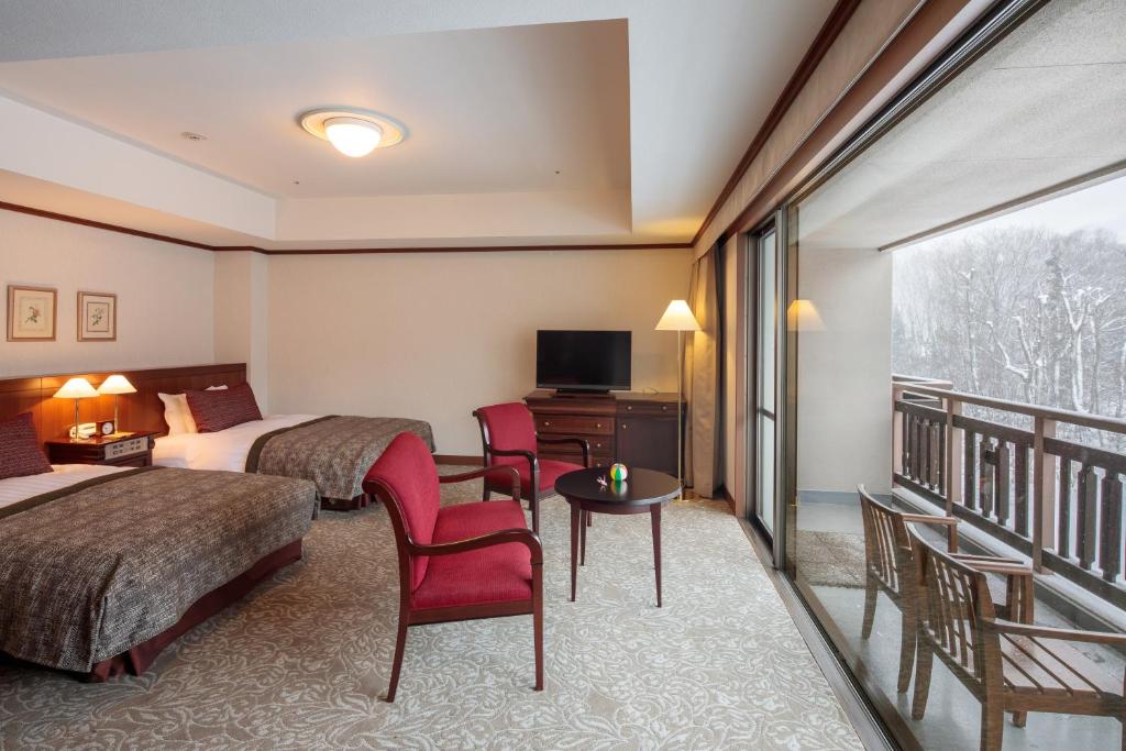 Postel nebo postele na pokoji v ubytování Hakuba Tokyu Hotel