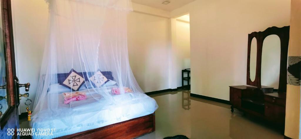 Postel nebo postele na pokoji v ubytování Dulmini Homestay