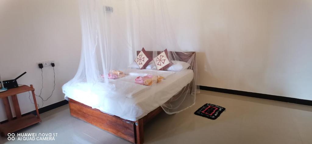 Postel nebo postele na pokoji v ubytování Dulmini Homestay