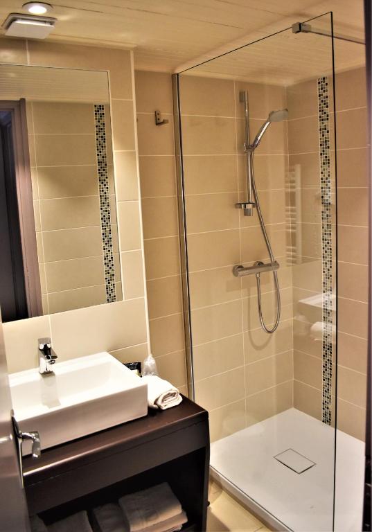 Koupelna v ubytování Hotel Corrieu