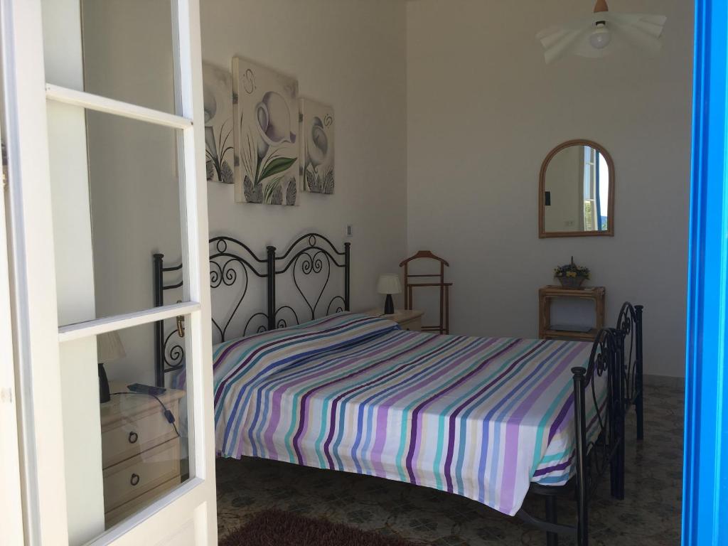 Postel nebo postele na pokoji v ubytování Casa Direttamente sul mare