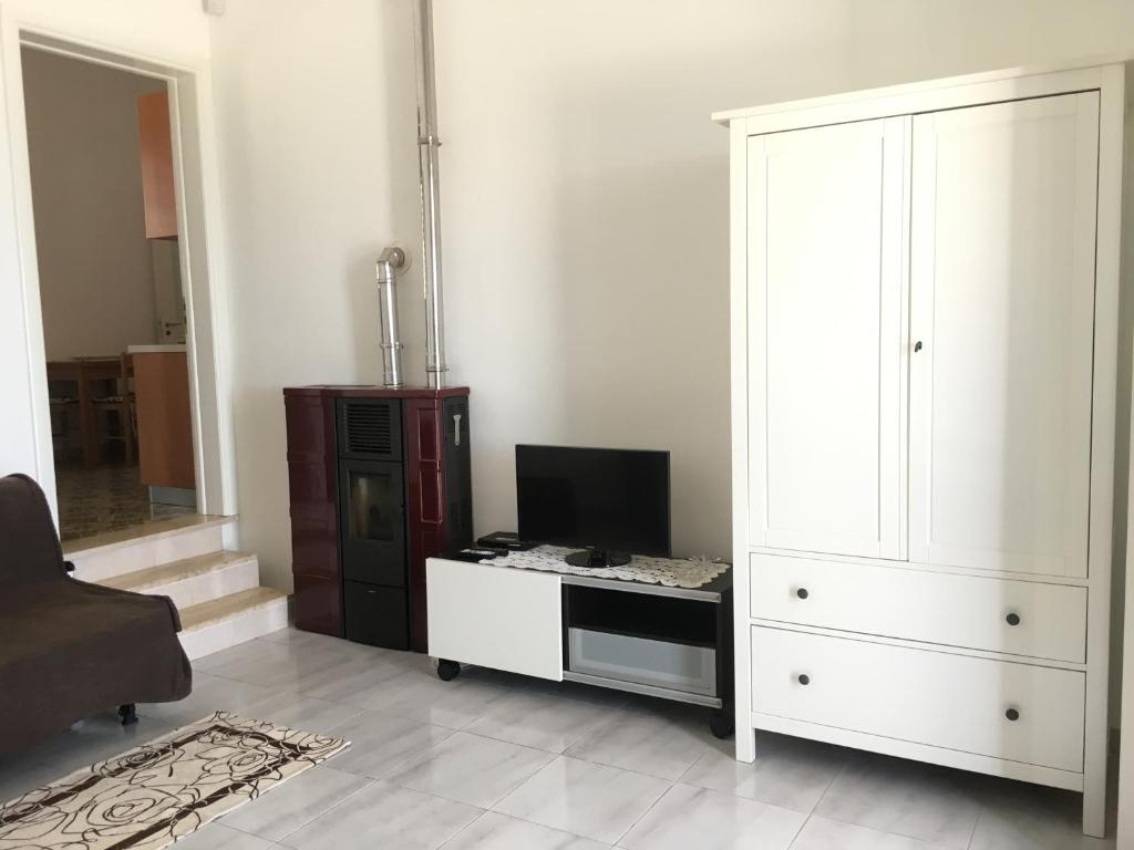 TV a/nebo společenská místnost v ubytování Casa Direttamente sul mare