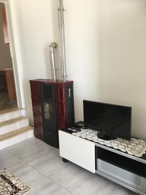 TV a/nebo společenská místnost v ubytování Casa Direttamente sul mare