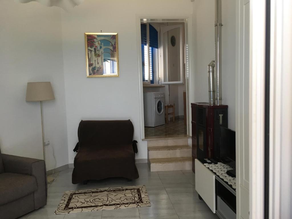 TV a/nebo společenská místnost v ubytování Casa Direttamente sul mare