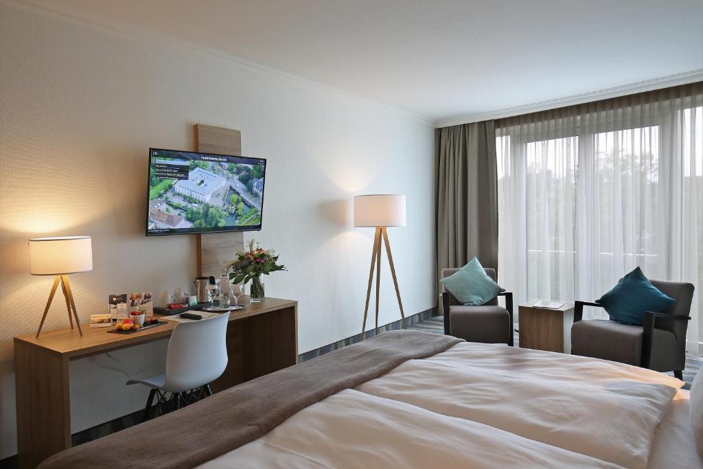 Postel nebo postele na pokoji v ubytování Quality Hotel Lippstadt