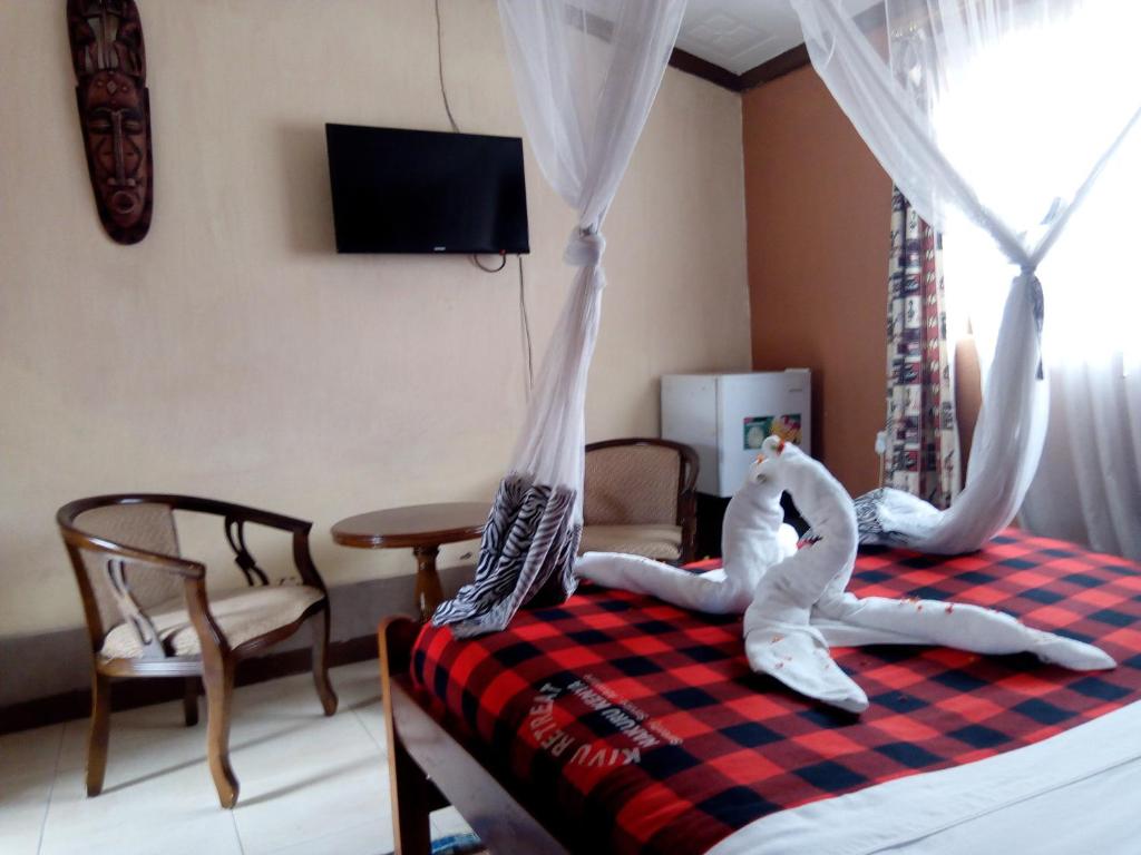 TV a/nebo společenská místnost v ubytování Kivu Resort