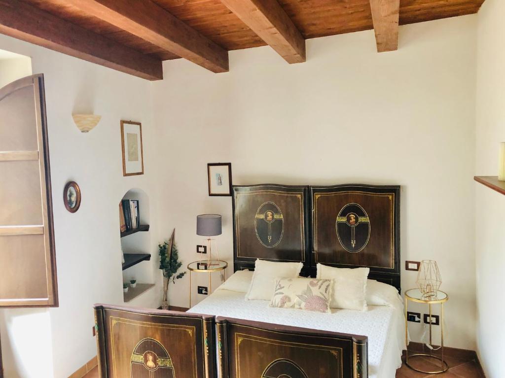 Posteľ alebo postele v izbe v ubytovaní Appartamento Il Cappero