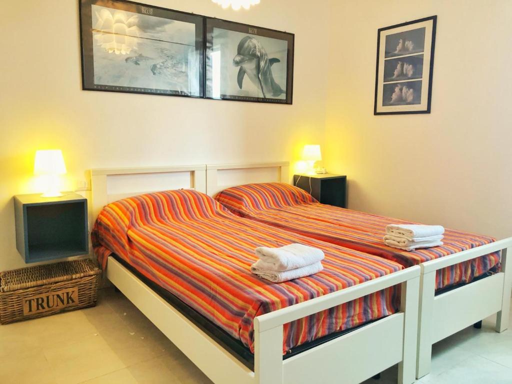 A bed or beds in a room at Appartamento a Corte Balai