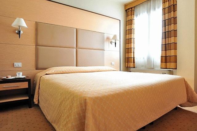 Postel nebo postele na pokoji v ubytování Inn Hotel